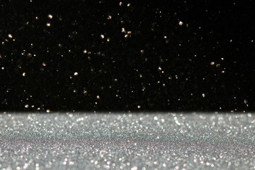 Obraz premium glitter vintage lights background. black and silver. de-focused.