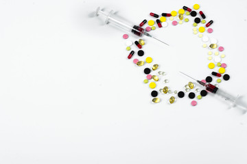 Many colorful pills and tablets isolated on white. vitamin pills. Collection of medicine pills on table.Lots of different medicine drugs, pills, tablets, capsules