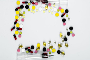 Many colorful pills and tablets isolated on white. vitamin pills. Collection of medicine pills on table.Lots of different medicine drugs, pills, tablets, capsules