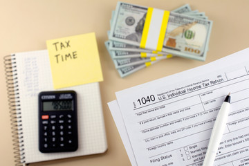 Tax form business financial concept with a pen. tax forms 1040 Pay tax  concept.
