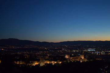 Panorama of Granada, Alhambra and Sierra Nevada with Afterglow seen from Sacromonte Hill, Spain