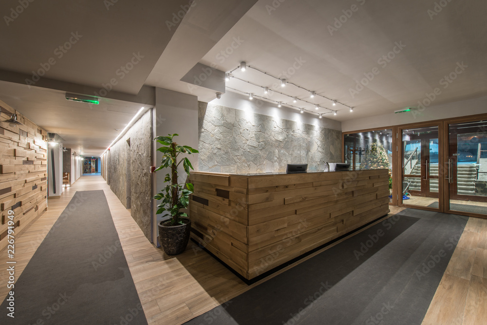 Wall mural Reception desk and view on hallway in modern hotel