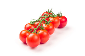 Cherry tomatoes isolated over white background