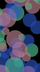 Multicolored translucent circles on a dark background. Vertical image orientation. 3D illustration