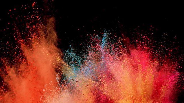 Super slow motion of coloured powder explosion isolated on black background. Filmed on high speed cinema camera, 1000fps.