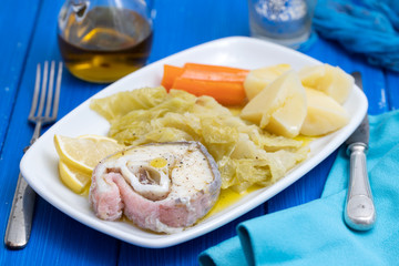 boiled fish with boiled vegetables on dish