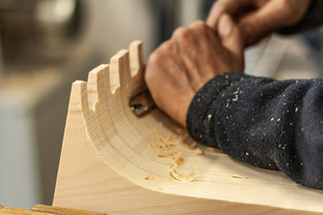 Eco friendly woodworker's shop. Details and focus on the texture of the material, saw dust, and...
