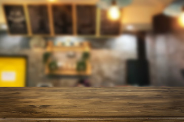 Selected focus empty brown wooden table and Coffee shop or restaurent blur background with bokeh image. for your photomontage or product display.