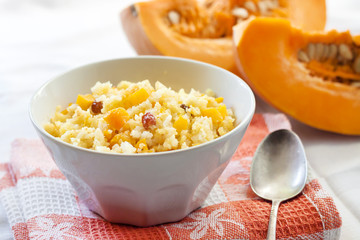 Milky cereal porridge with pumpkin and raisins