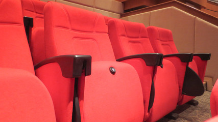 row of red seat in seminar hall