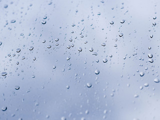 Drops of rain on glass , rain drops on clear window.