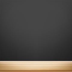 Wooden table against the background of a black wall for chalk.