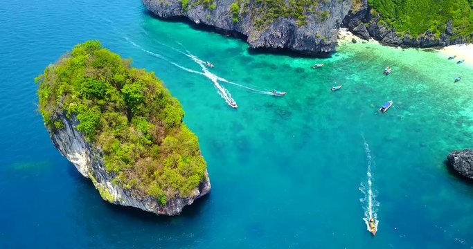 Aerial Overhead View of Nui Beach, Phuket, Thailand - Multiple Boats Moving in Bay with Beach Visible in Cove