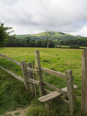 A view towards Wolstonbury Hill surrounded by low cloud on an overcast summer day near the South...