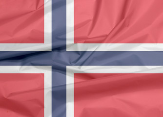 Fabric flag of Norway. Crease of Norwegian flag background, a white-fimbriated blue Nordic cross on a red field.