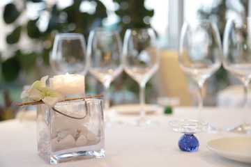 centerpiece candle in an elegant restaurant for weddings