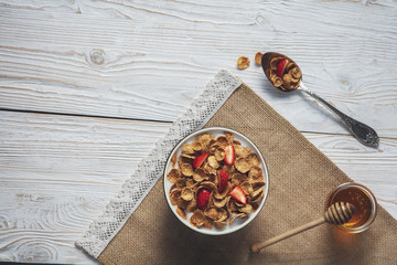 Breakfast of oatmeal with strawberries.