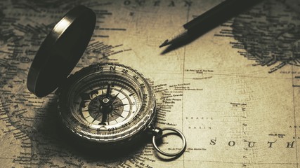 Fototapeta na wymiar Old compass on antique map. - vintage background style.