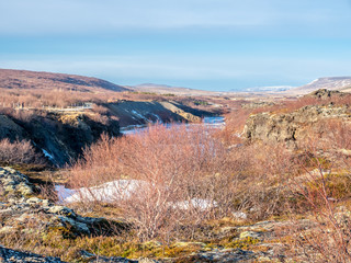 Beautiful landscape view of mountain, sky and river near Hraufossar waterfall in Iceland