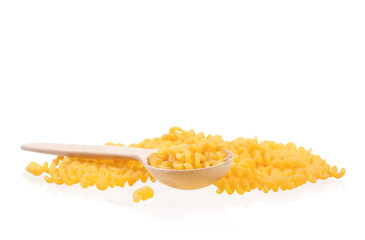 Wooden spoon with dry yellow pasta isolated on white background. Uncooked Italian raw pasta. 