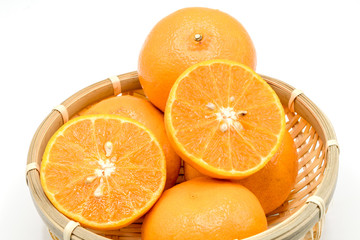 Fresh Mandarin oranges fruits, tangerine in basket  isolated on white background.