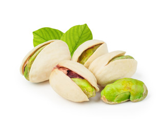 Pistachios with leaves isolated on white background