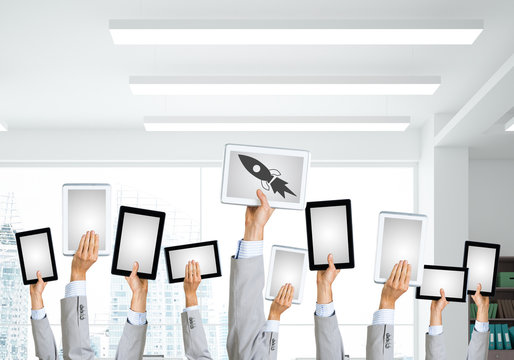 Close of businessman hands in line showing tablet pc with blank screen. Mixed media