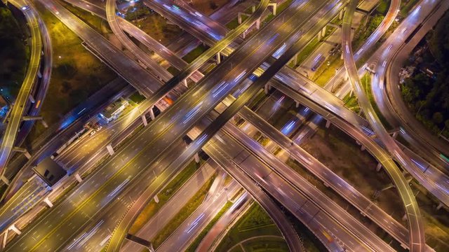 Aerial Hyperlapse of Traffic over big intersection bridges and ring road. 4K aerial view by a drone over big roundabout in Bangkok Thailand.	