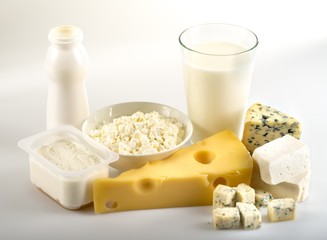 Dairy Products- Cheeses and Milk on the Grey Background