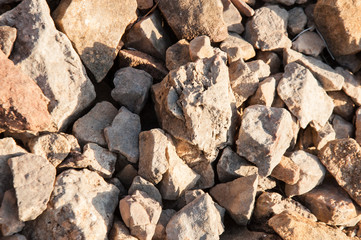 big pile of rocks and boulders piled with beautiful sunset light,