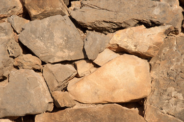 big pile of rocks and boulders piled with beautiful sunset light,