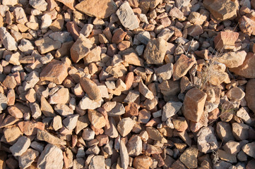 big pile of rocks and boulders piled with beautiful sunset light,