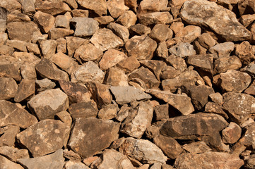big pile of rocks and boulders piled with beautiful sunset light,