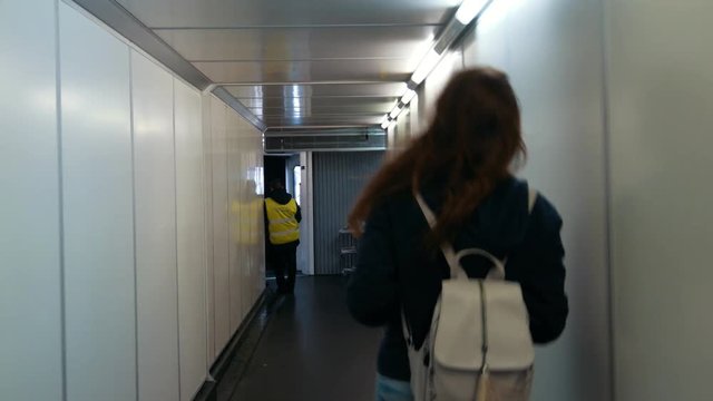Airport. Young women going on her flight.
