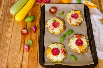 zucchini pizza with pepperoni, tomatoes, cheese and basil
