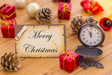 Greeting card for new year or christmas with pocket watch and christmas decorations