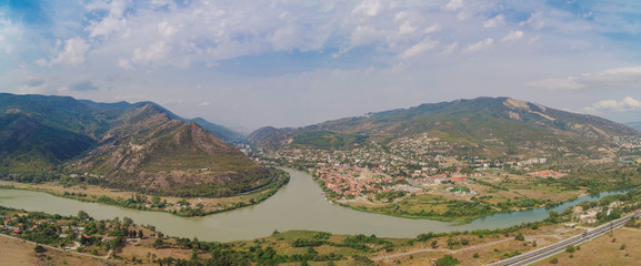Panoramic view of the confluence of the Kura and Aragvi rivers and historic center of Mtskheta....