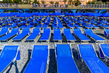 Naklejka premium Blue chairs on the beach of Monterosso Al Mare Italy 