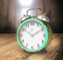 Retro alarm clock on wooden table