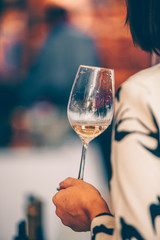 Beauty with red and wose wine glass - front view hand