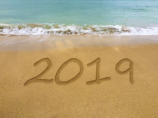 2019 written in the sand on a beautiful Brazilian beach.