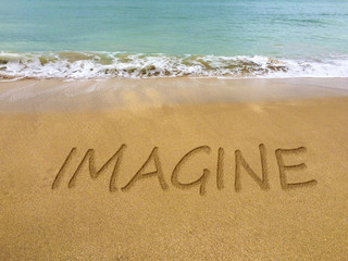 Imagine written in the sand on a beautiful Brazilian beach.
