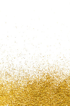 Golden glitter in the form of a gradient on a white background.