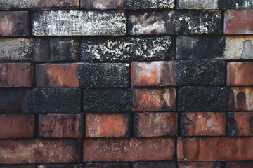 Dirty charred folded bricks