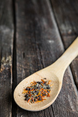 pepper in wooden spoon