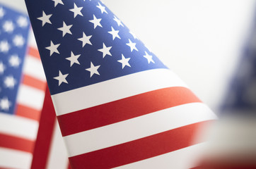 American Flag Close Up shot shallow depth of field. Stars and Stripes Flag printed on paper.