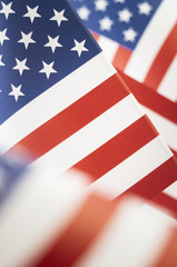 American Flag Close Up shot shallow depth of field. Stars and Stripes Flag printed on paper.