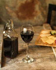 glass of red wine on a wooden table. top view. food background