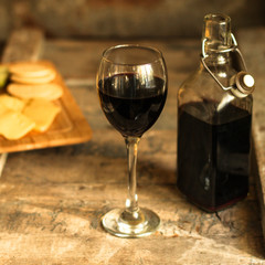 glass of red wine on a wooden table. top view. food background