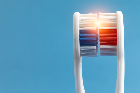 Beam Of Light Between Two Toothbrushes